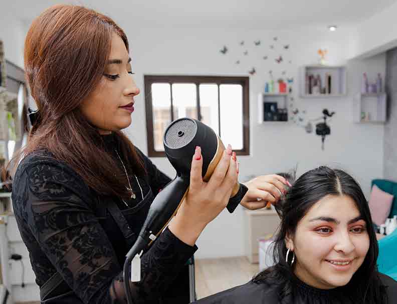 Hispanic Woman Styling Hair